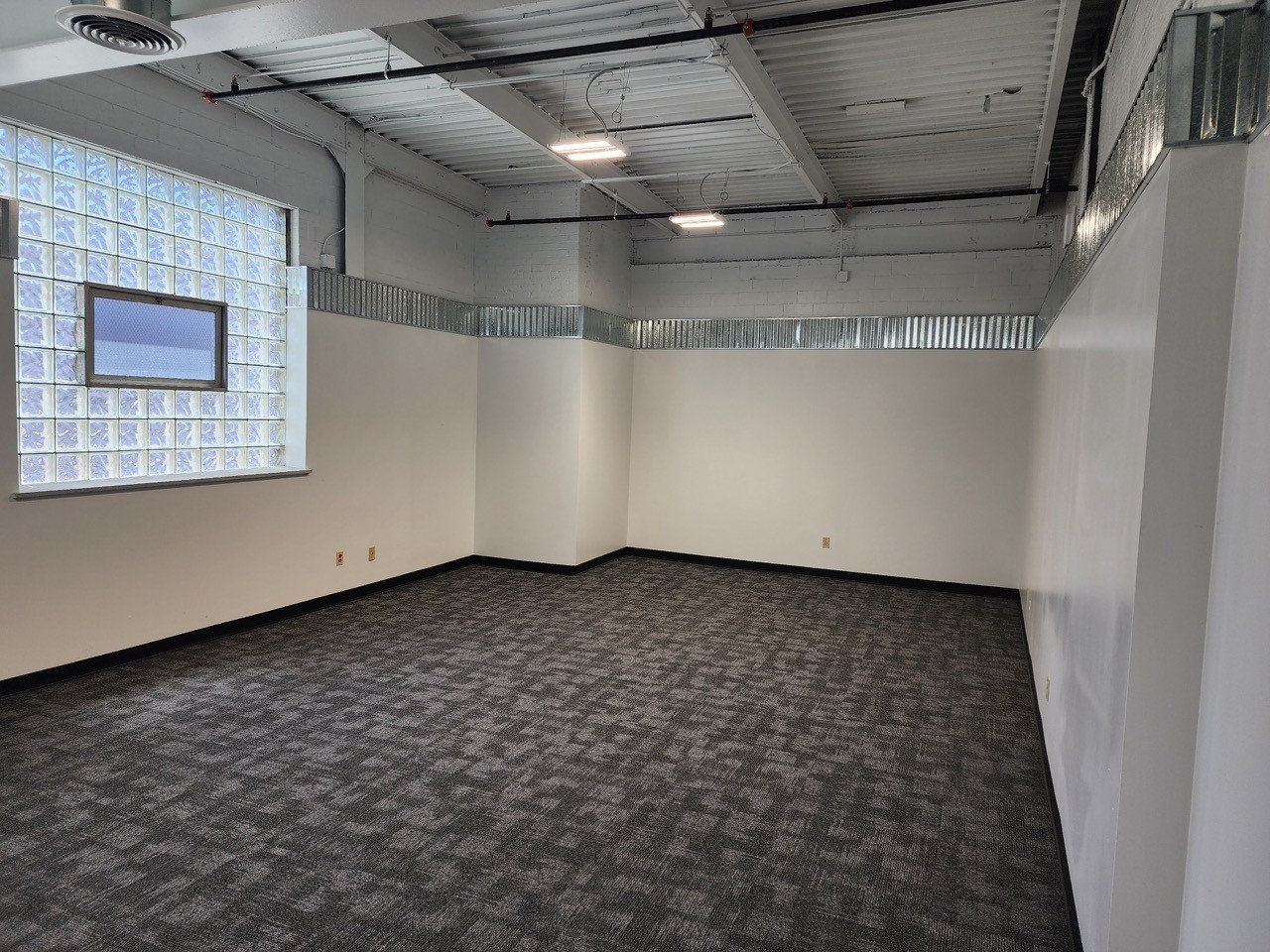 Move-in ready office at 939 W. North Ave with new carpet and freshly painted walls