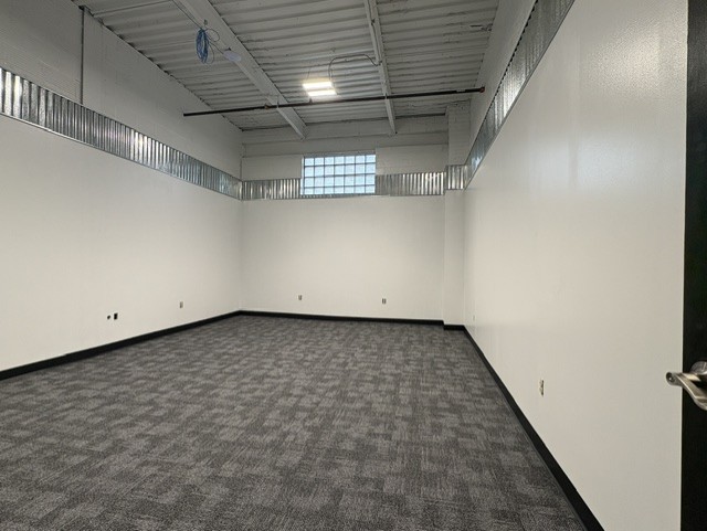 Office 3 — 318 SF with glass-block window